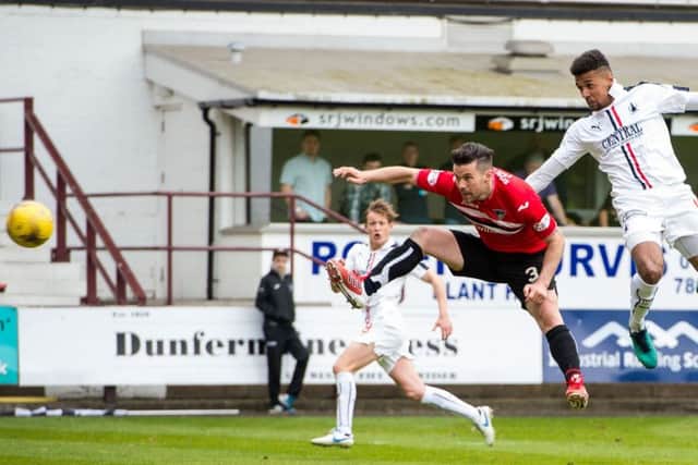 Nathan Austin, right, heads home Falkirks winner against Dunfermline. Photograph: Ross Parker/SNS