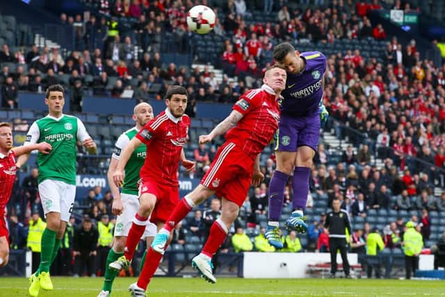 Hibernian goalkeeper Ofir Marciano tries to rescue a draw. Pic: Andrew Milligan/PA Wire.