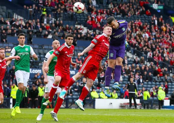 Hibernian goalkeeper Ofir Marciano tries to rescue a draw. Pic: Andrew Milligan/PA Wire.