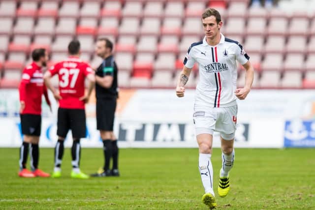 Falkirk's Aaron Muirhead celebrates his penalty as Dunfermline players protest to the referee. Pic: SNS/Ross Parker