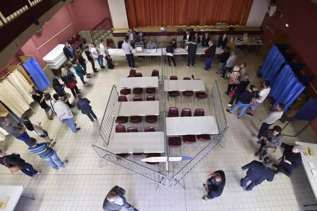 People line up to vote at a polling station in Martres-Tolosane, southwestern France, during the first round of the French presidential election. Picture: AFP Photo