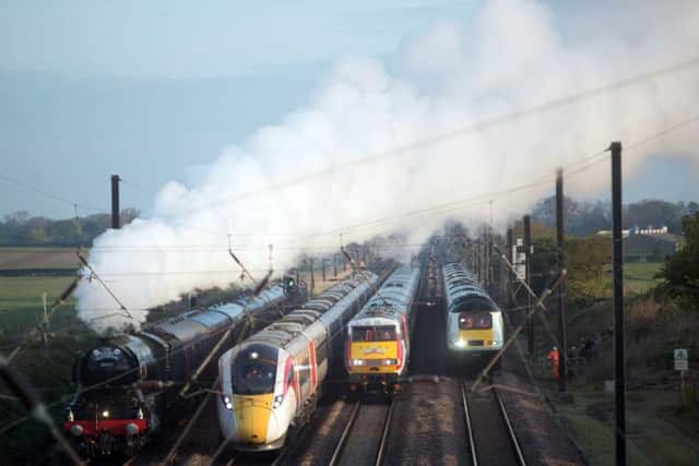 Three Azuma trains travel alongside the Flying Scotsman in a world first event to mark the past, present and future of rail travel. Picture: PA