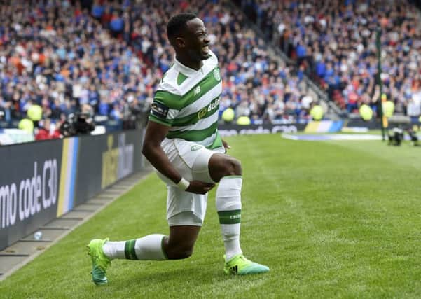 Celtic's Moussa Dembele feels his hamstring after pulling up with an injury. Picture: SNS
