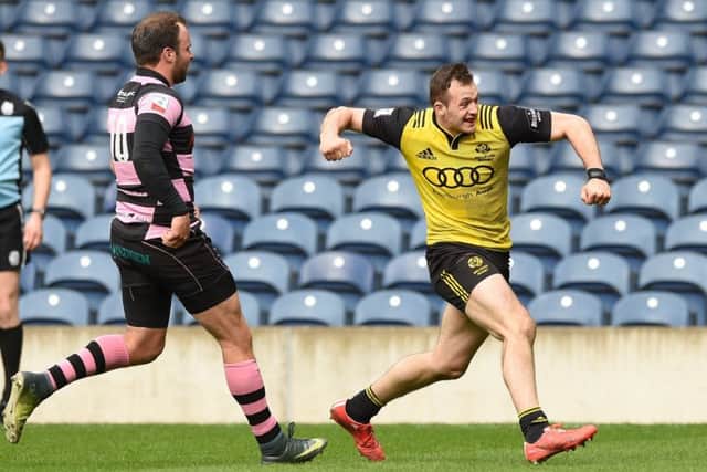 Melrose centre Nyle Godsmark, right, celebrates scoring the winning try against Ayr in the BT Cup final at Murrayfield. Picture: SNS/SRU