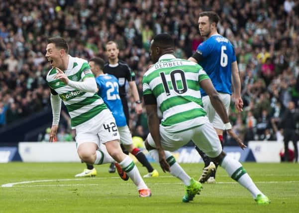 Callum McGregor wheels away in celebration after opening the scoring. Picture: SNS.