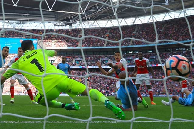 Alexis Sanchez scores  to send Arsenal into the FA Cup final. Picture: PA.