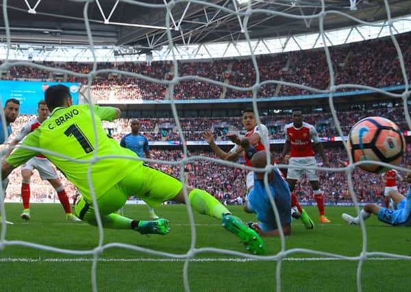 Alexis Sanchez scores  to send Arsenal into the FA Cup final. Picture: PA.