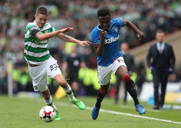 Mikael Lustig of Celtic vies with Joe Dodoo of Rangers. Picture: Getty