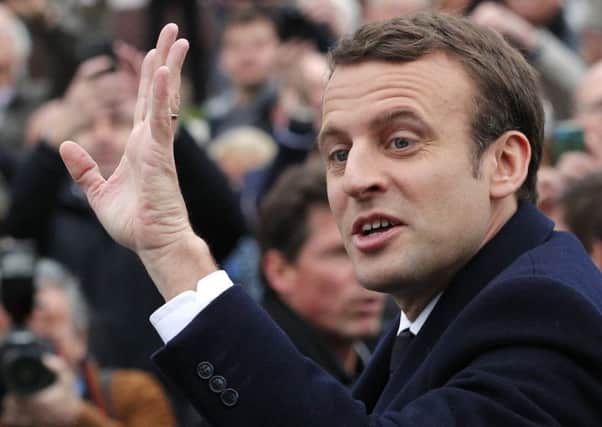Emmanuel Macron waves to supporters. (AP Photo/Christophe Ena)