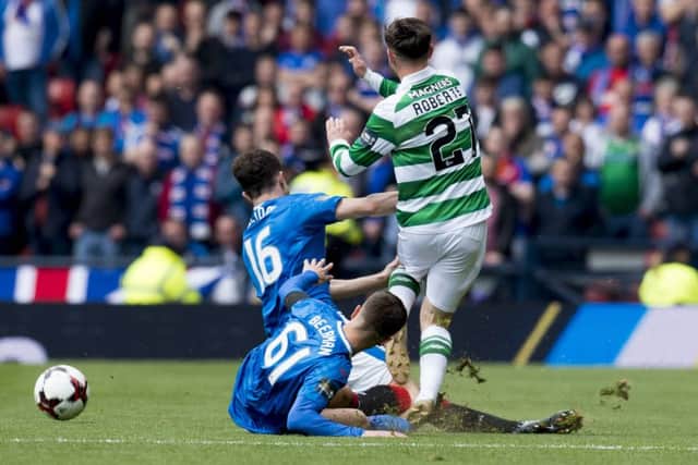 Patrick Roberts, right, is taken out by Andy Halliday, left. Picture: SNS