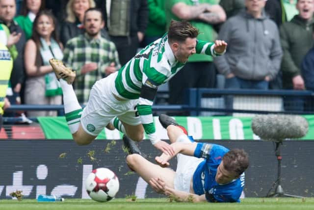 Patrick Roberts is sent flying by a challenge from Andy Halliday at Hamden on Sunday. Picture: Ian Sneddon/Universal News And Sport (Scotland)