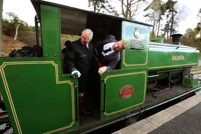 The Duke of Rothesaywith crew member James West as he drives the steam train "Salmon". Picture: PA