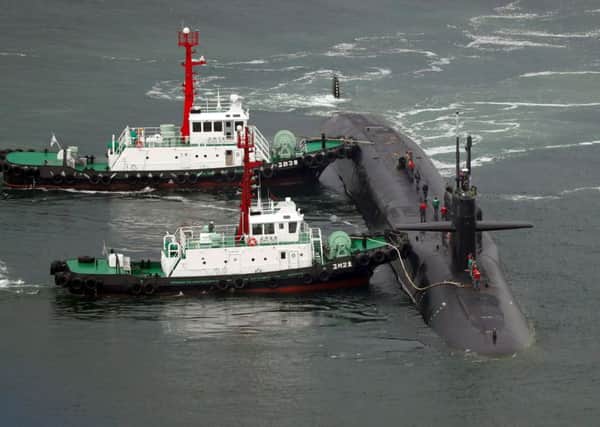 Nuclear-powered submarine USS Michigan approaches at the southeastern port city of Busan. Picture: AFP PHOTO / YONHAP / YONHAP /