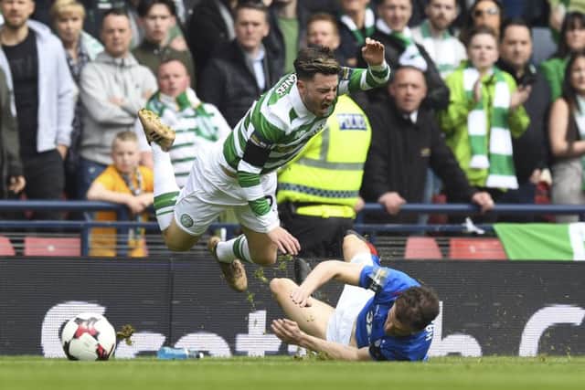 Patrick Roberts is hacked down by Rangers midfielder Andy Halliday. Picture: SNS