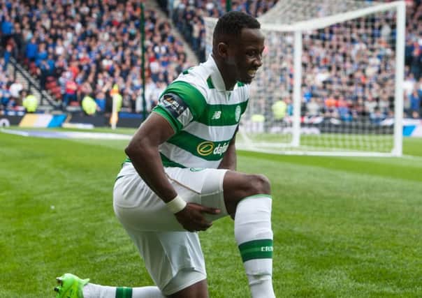 Moussa Dembele clutches his hamstring during the Scottish Cup semi-final against Rangers. Picture: John Devlin