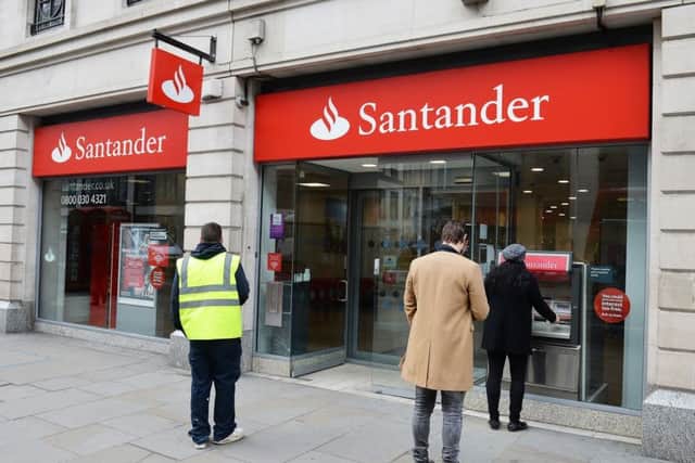 Santander warned of a 'potentially more challenging' economic outlook as it revealed lower UK profits. Picture: John Stillwell/PA Wire