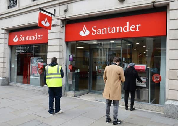 Santander warned of a 'potentially more challenging' economic outlook as it revealed lower UK profits. Picture: John Stillwell/PA Wire