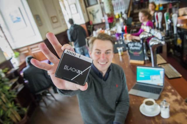Patrick Clover with his BlackBX wifi device. Picture: Chris Watt