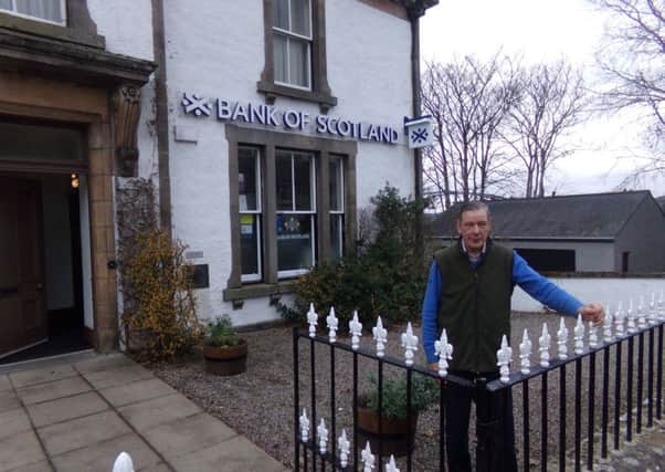 Michael Baird outside the Bank of Scotland branch in Bonar Bridge due to close in September, which is in the same building as his home.