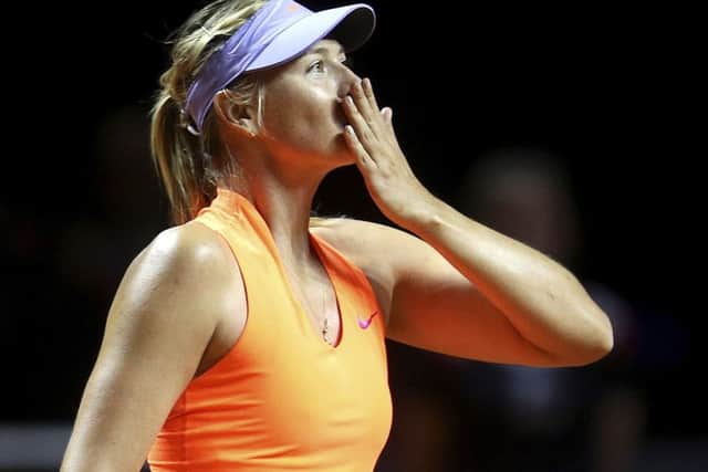 Russia's Maria Sharapova blows a kiss after winning 7-5, 6-3 against Italy's Roberta Vinci at the Porsche Grand Prix in Stuttgart. Picture: Michael Probst/AP