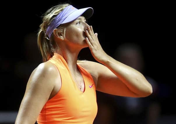 Russia's Maria Sharapova blows a kiss after winning 7-5, 6-3 against Italy's Roberta Vinci at the Porsche Grand Prix in Stuttgart. Picture: Michael Probst/AP