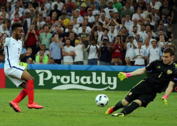 Advertising appears in the background at the Euro 2016 match between France and England.