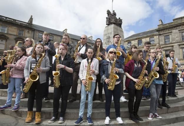 A mass outdoor rendition of Gerry Rafferty's classic Baker Street in Paisley.