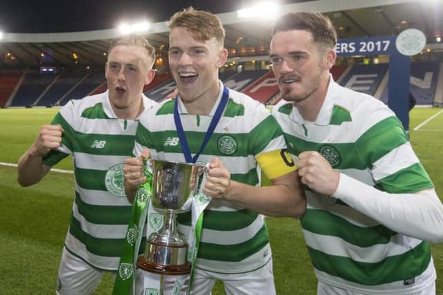 Celtic players Calvin Nesbitt, Sam Wardrop and Aidan Mcilduff celebrate with the trophy after winning the Scottish FA Youth Cup final at Hampden. Picture: Jeff Holmes/PA Wire