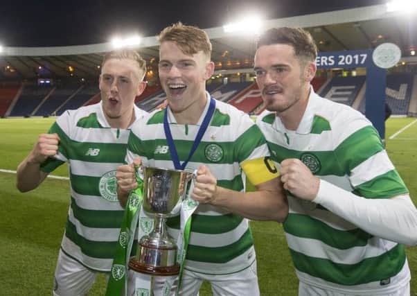 Celtic players Calvin Nesbitt, Sam Wardrop and Aidan Mcilduff celebrate with the trophy after winning the Scottish FA Youth Cup final at Hampden. Picture: Jeff Holmes/PA Wire
