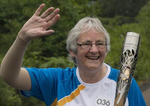 Fiona McEwan carries the 2014 Commonwealth Games baton