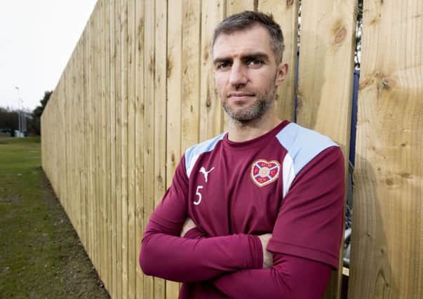 Aaron Hughes is seen by Ian Cathro is a vital player in his plans. Picture: SNS.