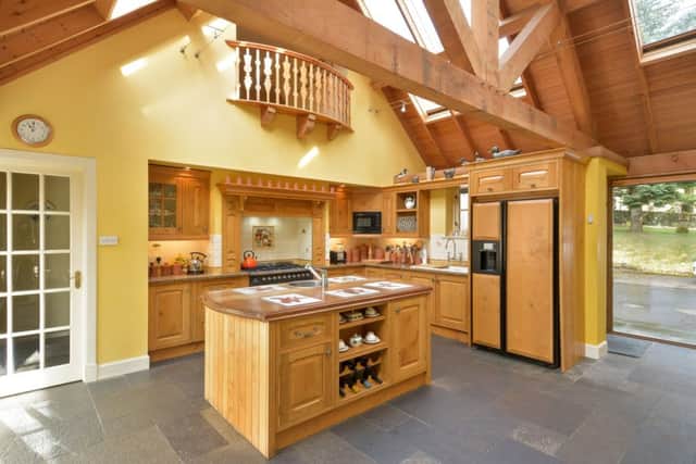 The kitchen is bespoke and links the main house to a former outbuilding.