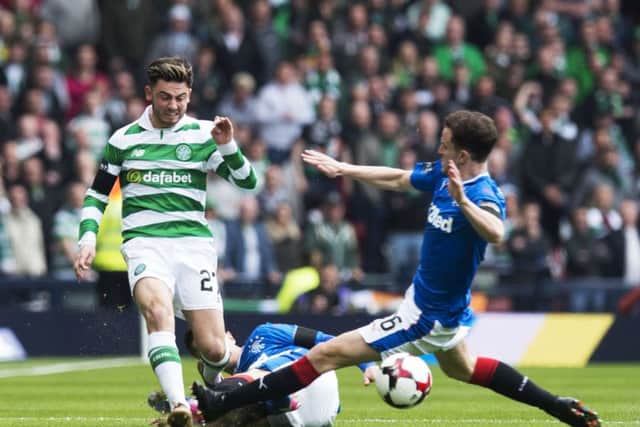 Celtic's Patrick Roberts is taken down by Rangers' Andy Halliday. Picture: SNS