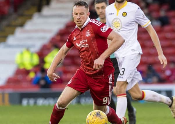 Aberdeen striker Adam Rooney is confident the Dons will stay fresh after an 11-month season. Picture: SNS.