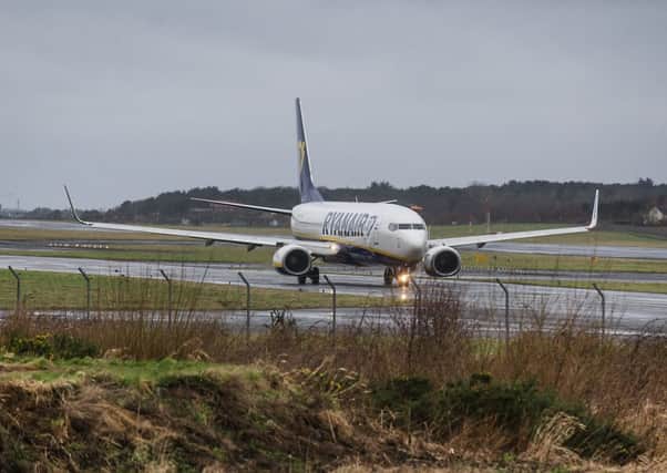 A flight arrives at Prestwick Airport.