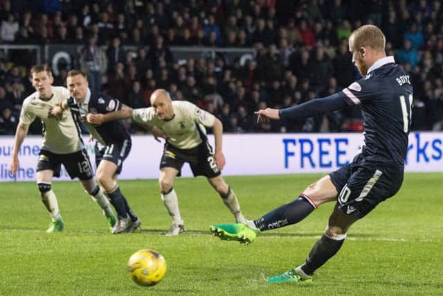 Ross County's Liam Boyce completes his hat-trick from the penalty spot. He went on to net a fourth. Picture: Craig Foy/SNS