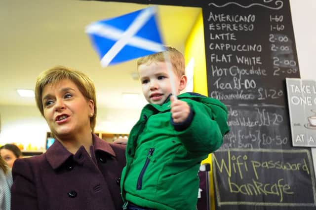 First Minister of Scotland and leader of the Scottish National Party (SNP), Nicola Sturgeon MSP (L) poses for a picture with two-year-old, Alasdair Murray (R) as she campaigns ahead of the general election in Neilston, on the outskirts of Glasgow, on April 28, 2017. Sturgeon campaigned with incumbent SNP candidate for East Renfrewshire Kirsten Oswald in Neilson on the outskirts of Glasgow ahead of the UK General Election on June 8. / AFP PHOTO / Andy BuchananANDY BUCHANAN/AFP/Getty Images