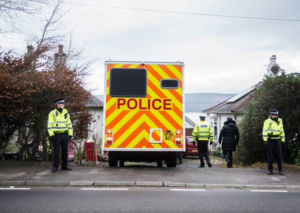 Police outside the home of missing woman Margaret Fleming in Inverkip. Picture: John Devlin