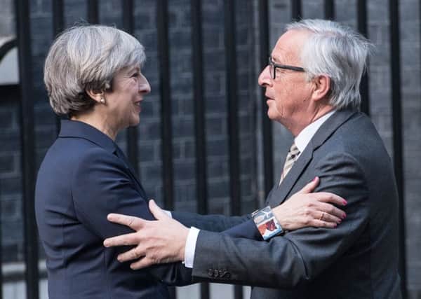 Theresa Mays dinner with EU Commission President Jean-Claude Juncker was less amicable than it appeared. Picture: Getty Images
