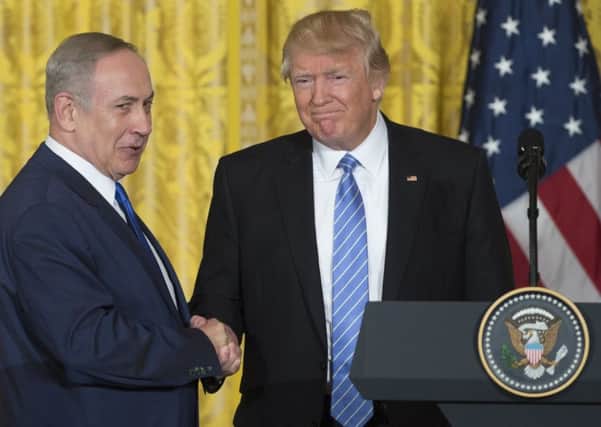 US President Donald Trump and Israeli Prime Minister Benjamin Netanyahu shake hands following a joint press conference. Picture: Saul Loeb/AFP/Getty Images