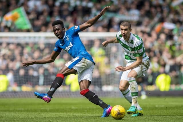 Celtic's Jozo Simunovic and Rangers' Joe Dodoo compete in a one-sided Old Firm encounter at Ibrox. Pic: Craig Watson/PA Wire.