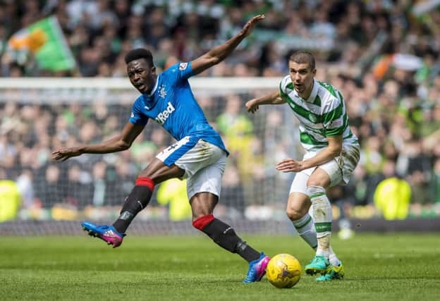 Celtic's Jozo Simunovic and Rangers' Joe Dodoo compete in a one-sided Old Firm encounter at Ibrox. Pic: Craig Watson/PA Wire.