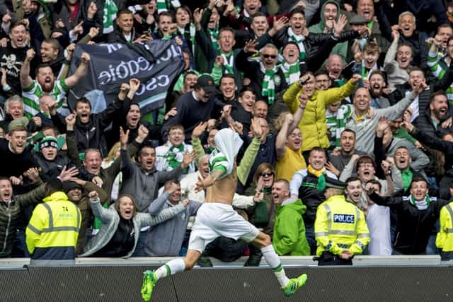 Celtic's Mikael Lustig celebrates after the fifth goal on Saturday. Picture: SNS