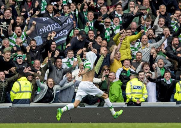 Celtic's Mikael Lustig celebrates after the fifth goal on Saturday. Picture: SNS