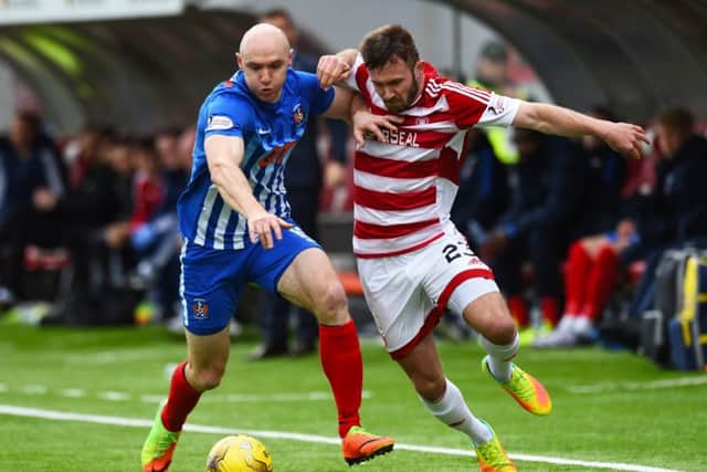 Kilmarnock's Conor Sammon and Hamilton's Scott McMann in action. Pic: SNS/Craig Foy
