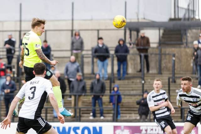 Hibernian's Jason Cummings rises high to put his side in front at Ayr. Pic: SNS/Roddy Scott