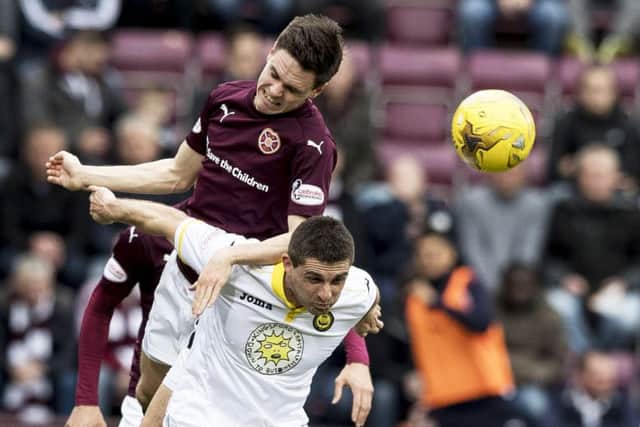 Hearts Liam Smith challenges for the ball with Partick Thistles Kris Doolan during yesterdays draw. Photograph: Alan Rennie/SNS Group