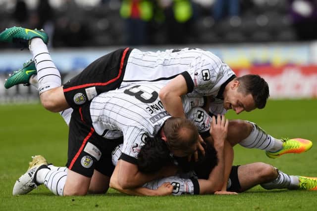 St Mirren players celebrate the victory that ensures they can no longer finish bottom of the league. Photograph: Bill Murray/SNS