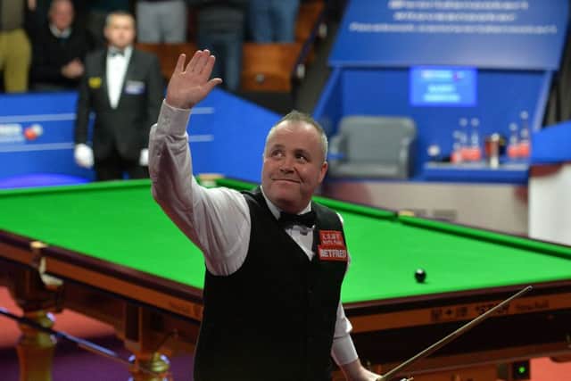 John Higgins acknowledges the crowd after winning his place in the final at the Crucible.  Photograph: Anna Gowthorpe/PA