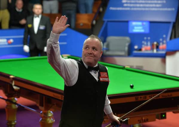 John Higgins acknowledges the crowd after winning his place in the final at the Crucible.  Photograph: Anna Gowthorpe/PA